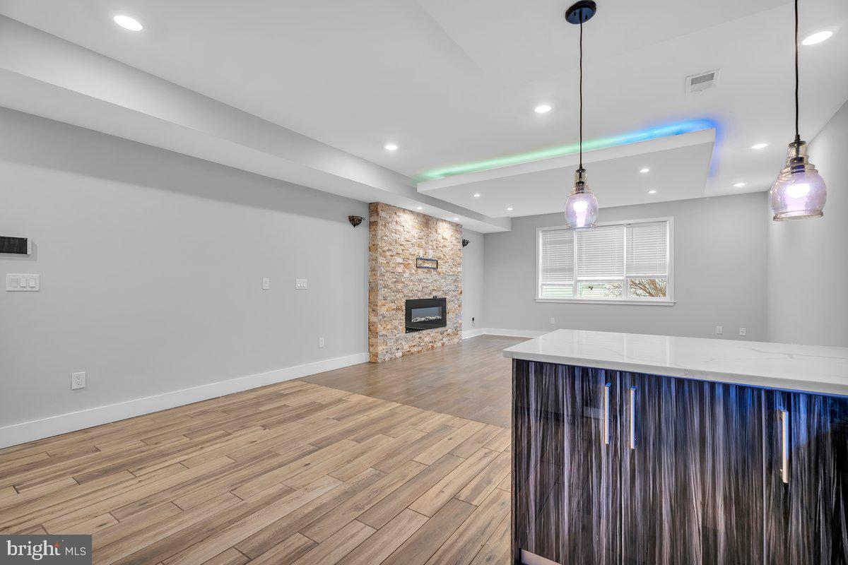 2562 Frankford Avenue, Unit 2 Philadelphia, PA 19125 - Photo 10 of 23 a view of an empty room with wooden floor and a window