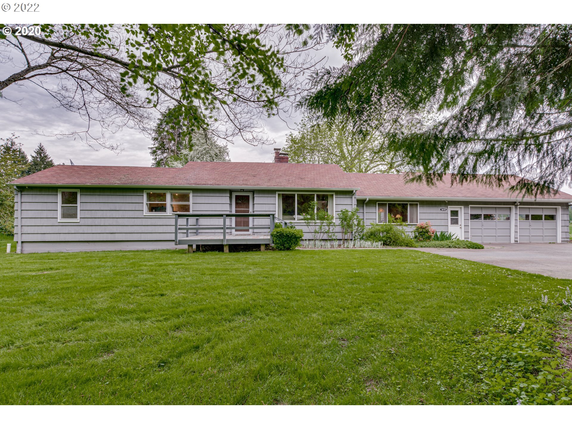 1650 North Royle Road Ridgefield, WA 98642 - Photo 24 of 24 a front view of a house with a garden