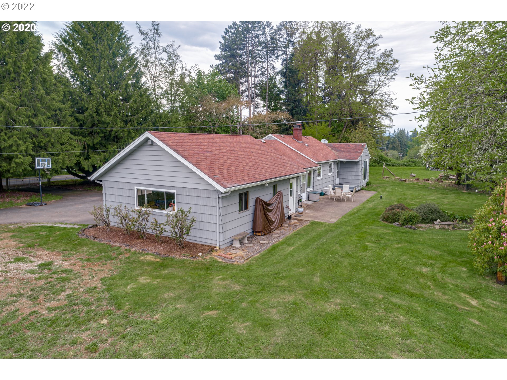 1650 North Royle Road Ridgefield, WA 98642 - Photo 4 of 24 a aerial view of a house with a yard table and chairs