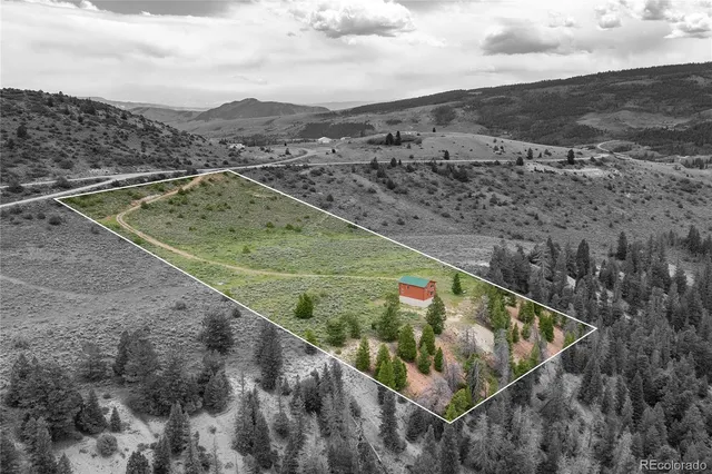 a view of a swimming pool with a yard