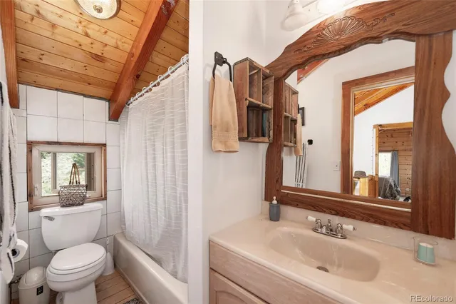 a view of a balcony with wooden floor