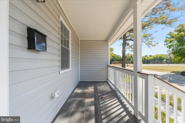a view of balcony with wooden floor
