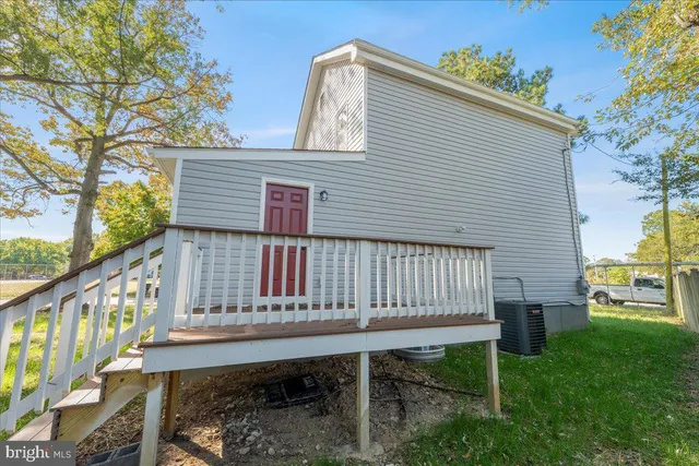 a view of a chair and table in the backyard