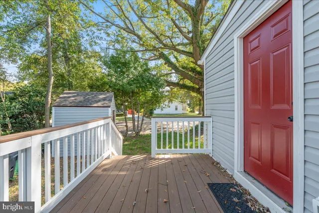 a view of a wooden fence and a yard
