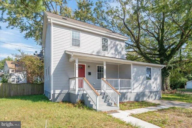 a front view of house with yard outdoor seating and barbeque oven