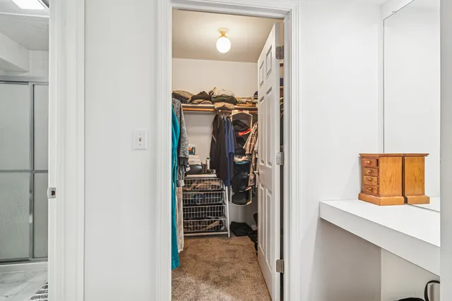 a bedroom with a bed and a chair