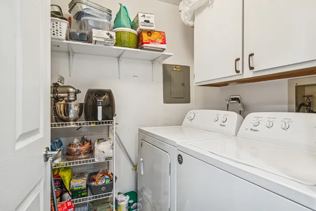 a view of a porch with a table and chairs and potted plants
