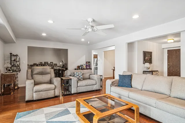 a view of a dining room with furniture and wooden floor