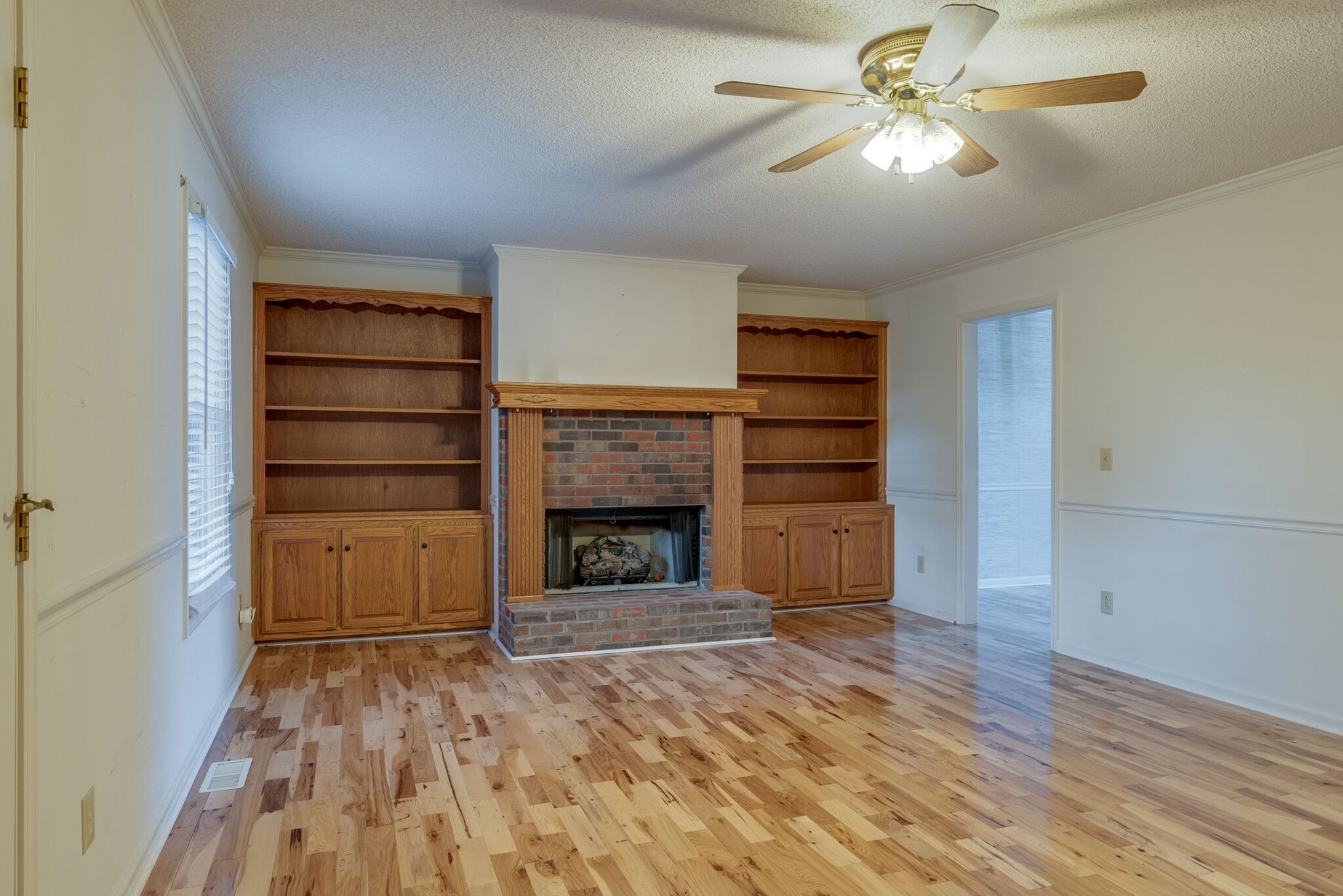 421 Ranch Road Portland, TN 37148 - Photo 12 of 38 a view of an empty room with a fireplace and a window