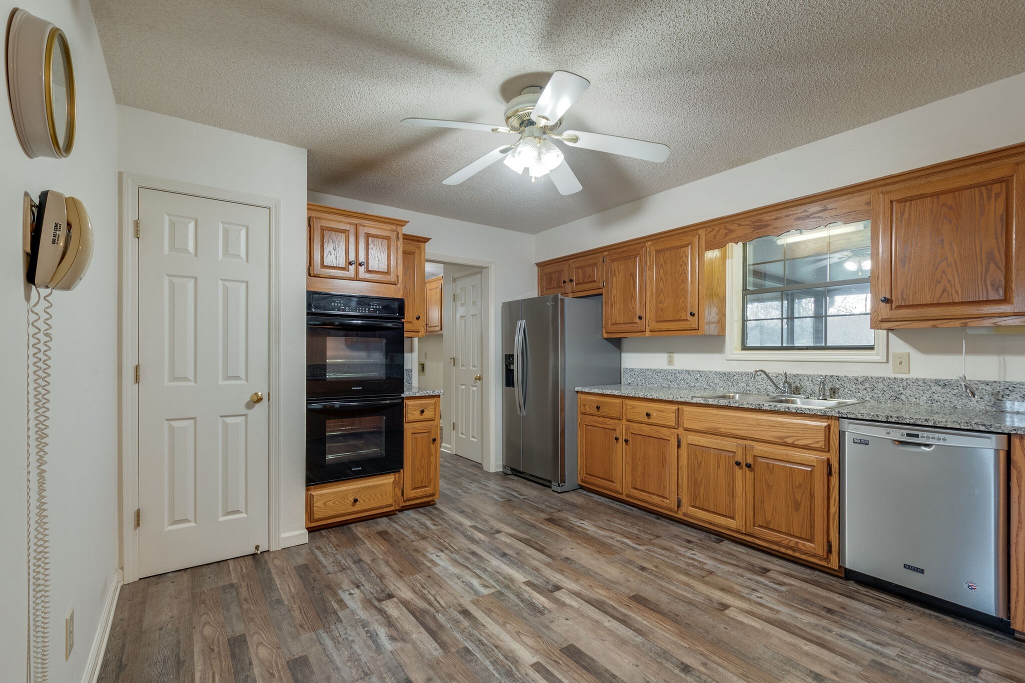 421 Ranch Road Portland, TN 37148 - Photo 13 of 38 a kitchen with stainless steel appliances granite countertop a stove and cabinets