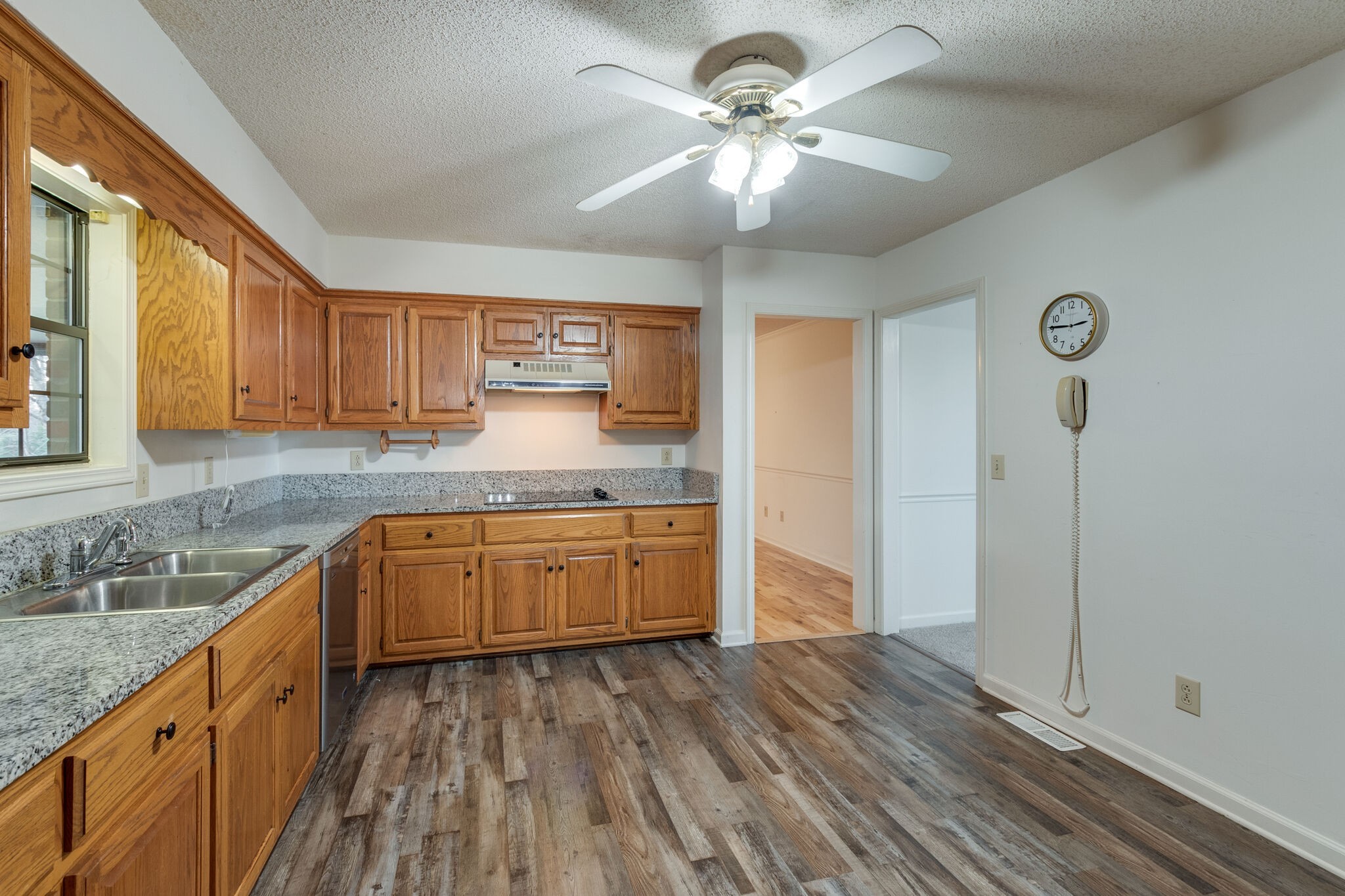 421 Ranch Road Portland, TN 37148 - Photo 15 of 38 a kitchen with stainless steel appliances granite countertop a sink cabinets and wooden floor