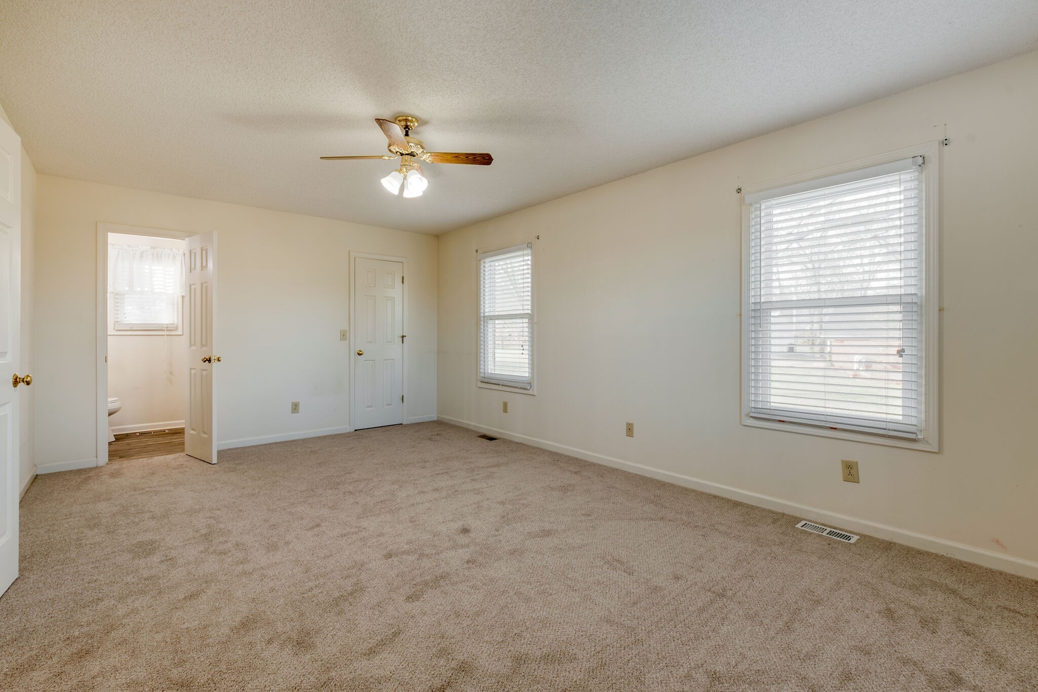 421 Ranch Road Portland, TN 37148 - Photo 17 of 38 an empty room with a window and a ceiling fan