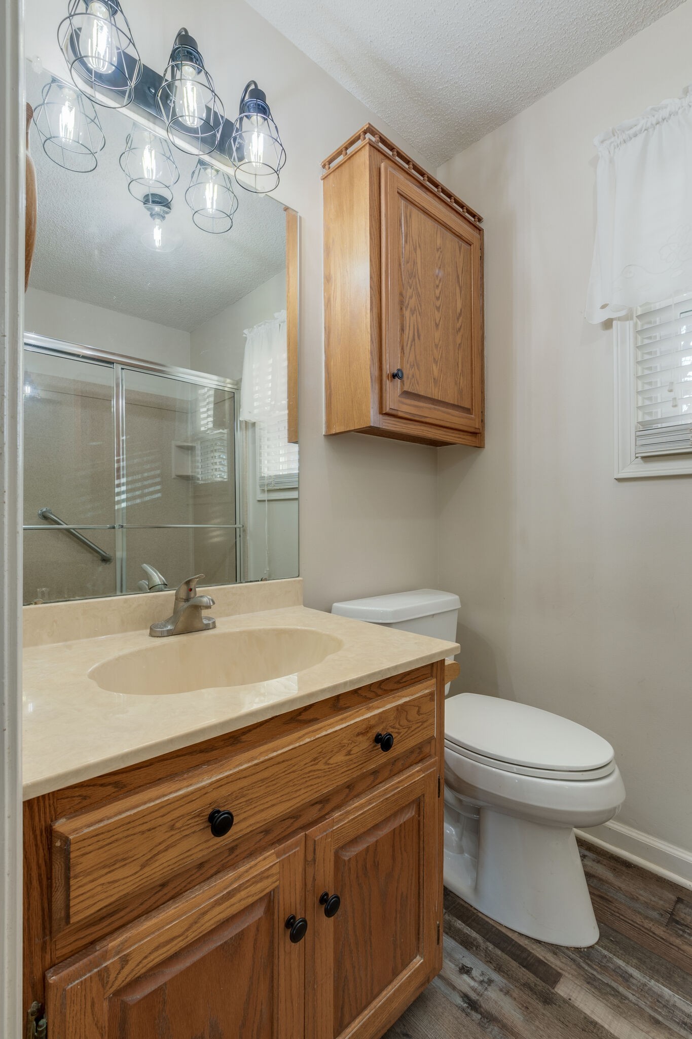 421 Ranch Road Portland, TN 37148 - Photo 19 of 38 a bathroom with a granite countertop sink a toilet and a mirror