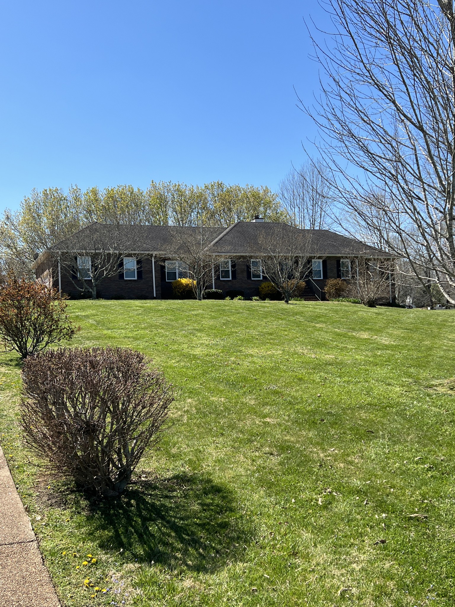 421 Ranch Road Portland, TN 37148 - Photo 3 of 38 a view of a garden with a building in the background