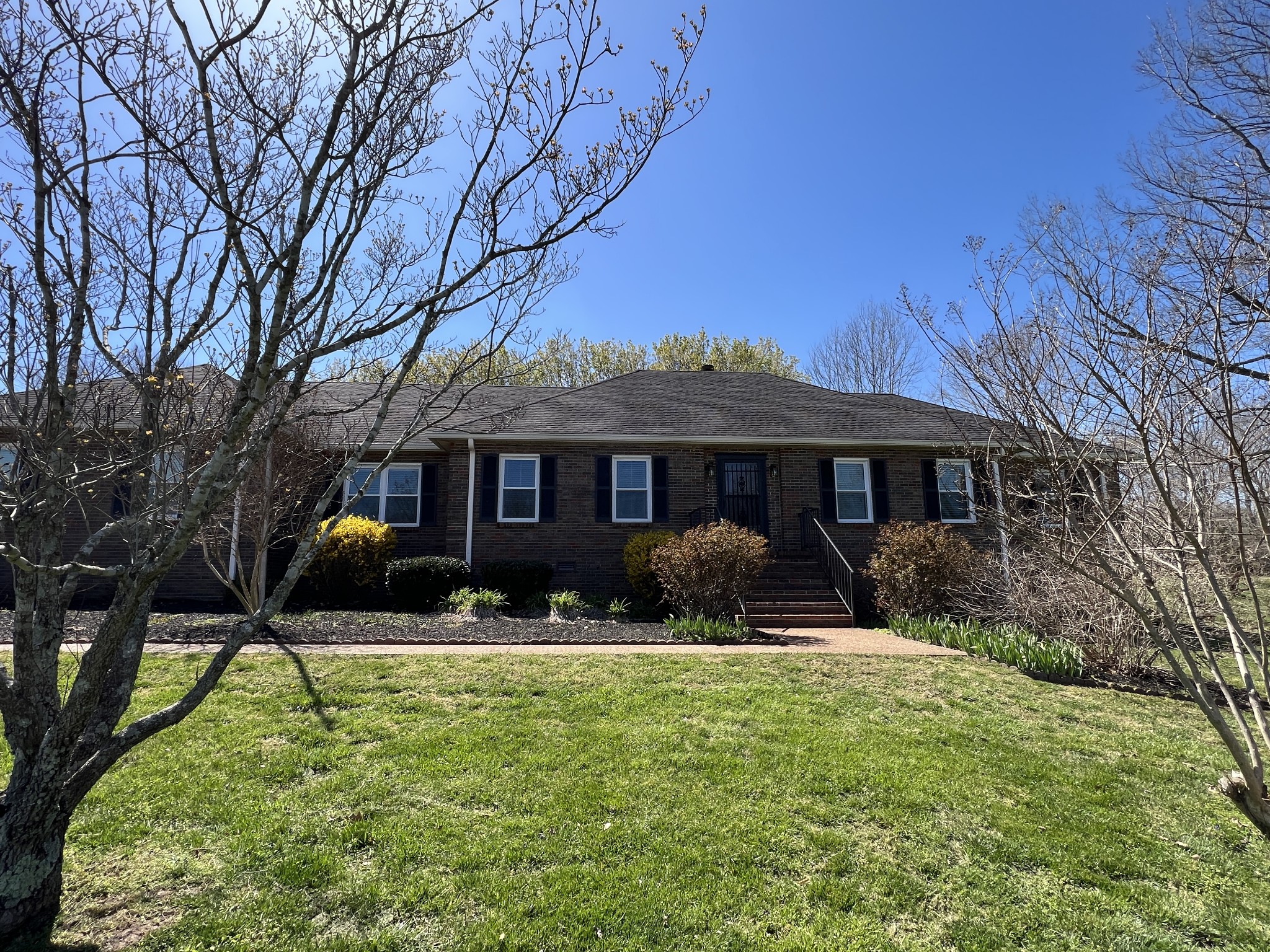 421 Ranch Road Portland, TN 37148 - Photo 37 of 38 a front view of house with yard outdoor seating and covered with green space