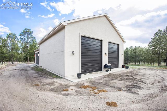 11628 Shaugnessy Road Colorado Springs, CO 80908 - Photo 39 of 50 View of garage