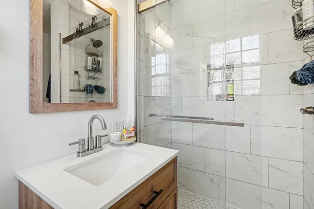 a bathroom with a sink and a mirror