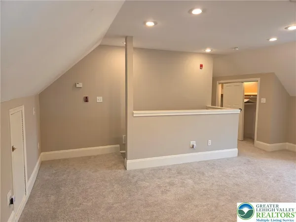 a large kitchen with stainless steel appliances granite countertop a stove and a refrigerator