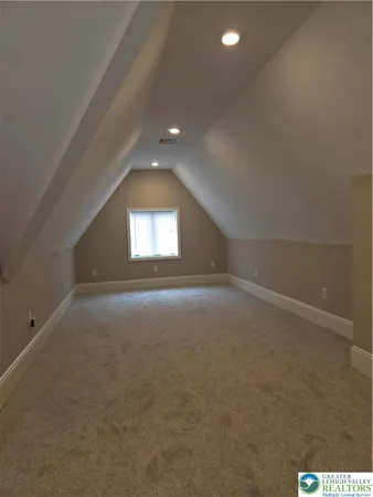 a living room with furniture and a mirror