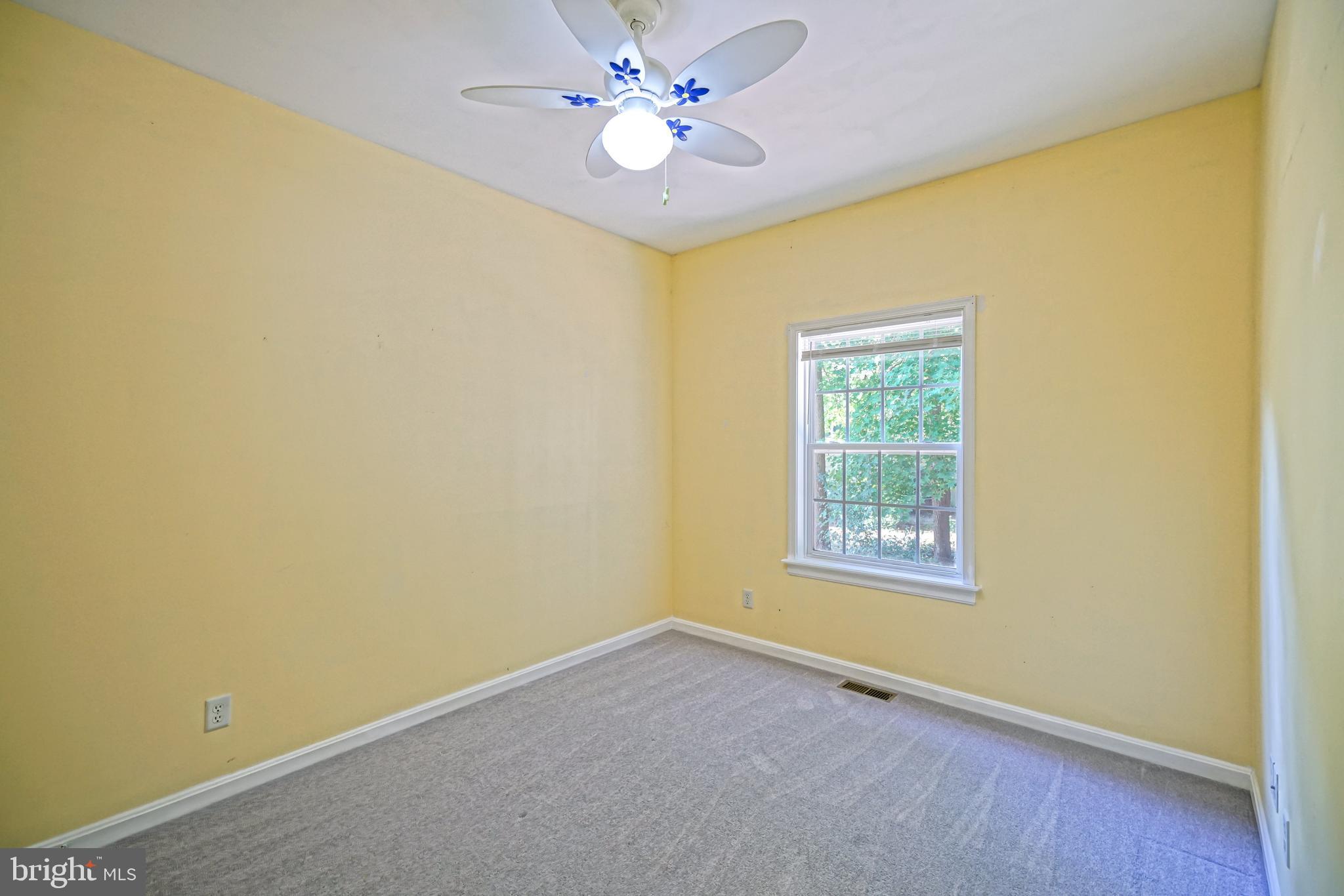 30869 Ridge Court Lewes, DE 19958 - Photo 25 of 42 an empty room with a window and a fan