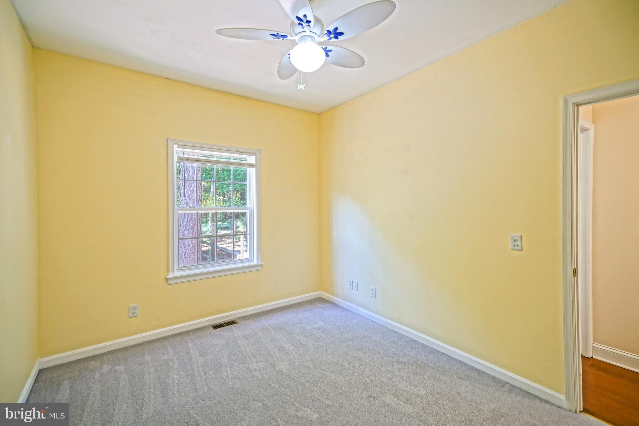 30869 Ridge Court Lewes, DE 19958 - Photo 28 of 42 an empty room with windows and fan