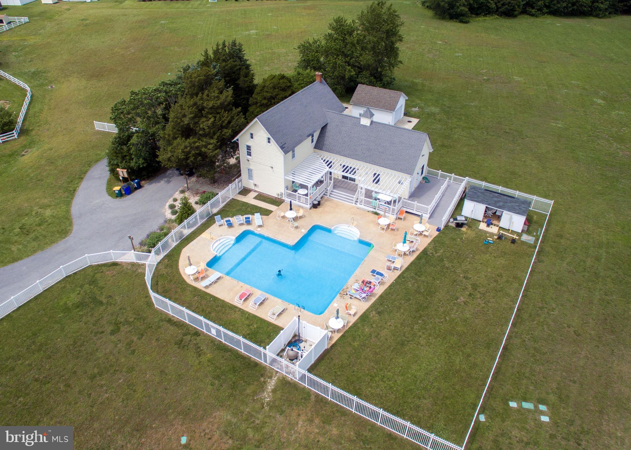 30869 Ridge Court Lewes, DE 19958 - Photo 41 of 42 an aerial view of a house with a garden and lake view