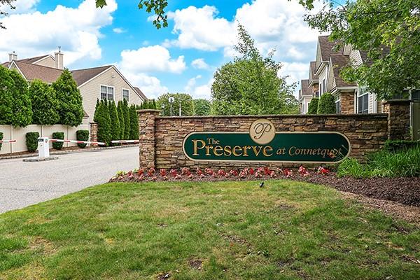 a view of outdoor space with sign board and garden