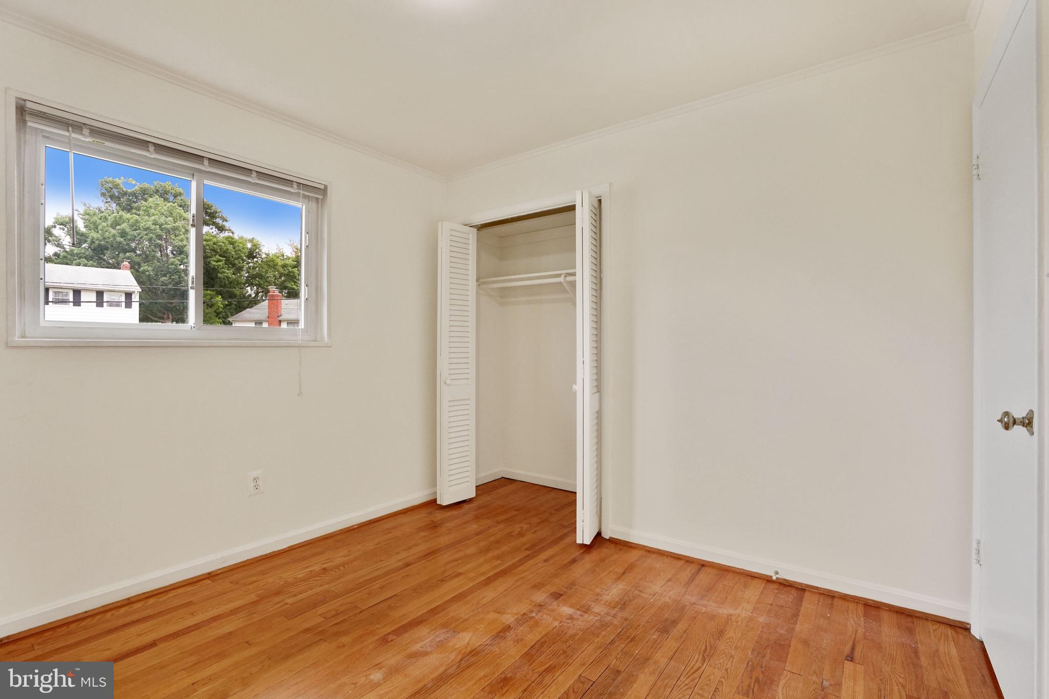 2911 Farm Road Alexandria, VA 22302 - Photo 19 of 35 a view of an empty room with wooden floor and a window