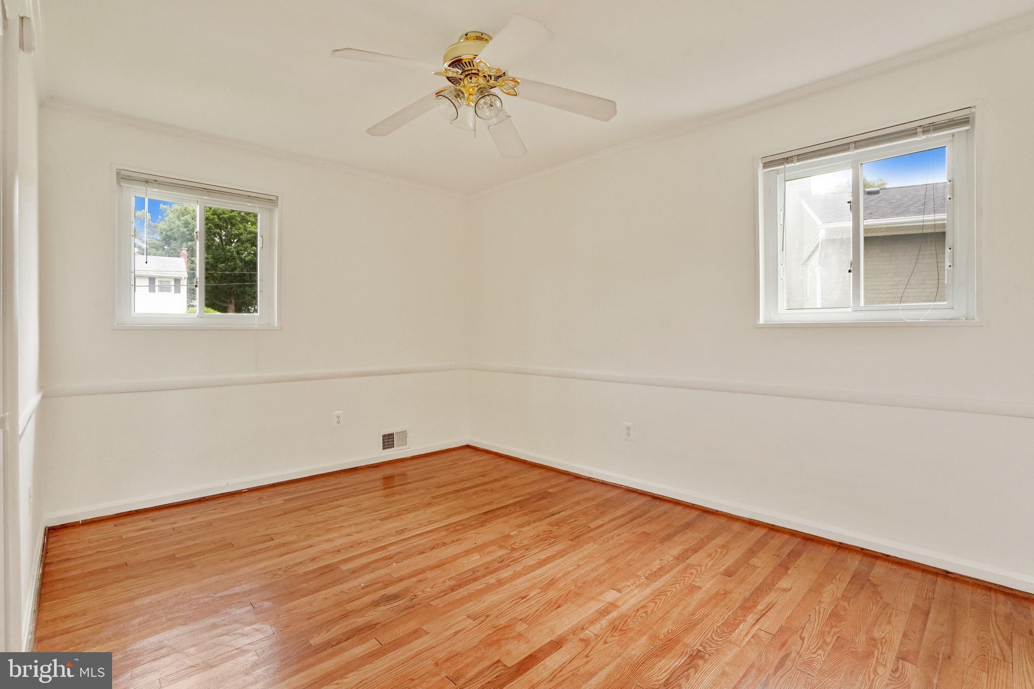 2911 Farm Road Alexandria, VA 22302 - Photo 20 of 35 a view of empty room with wooden floor and fan