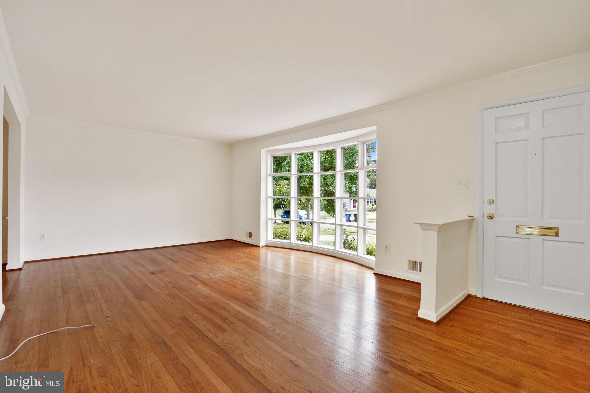 2911 Farm Road Alexandria, VA 22302 - Photo 2 of 35 a view of an empty room with wooden floor and a window