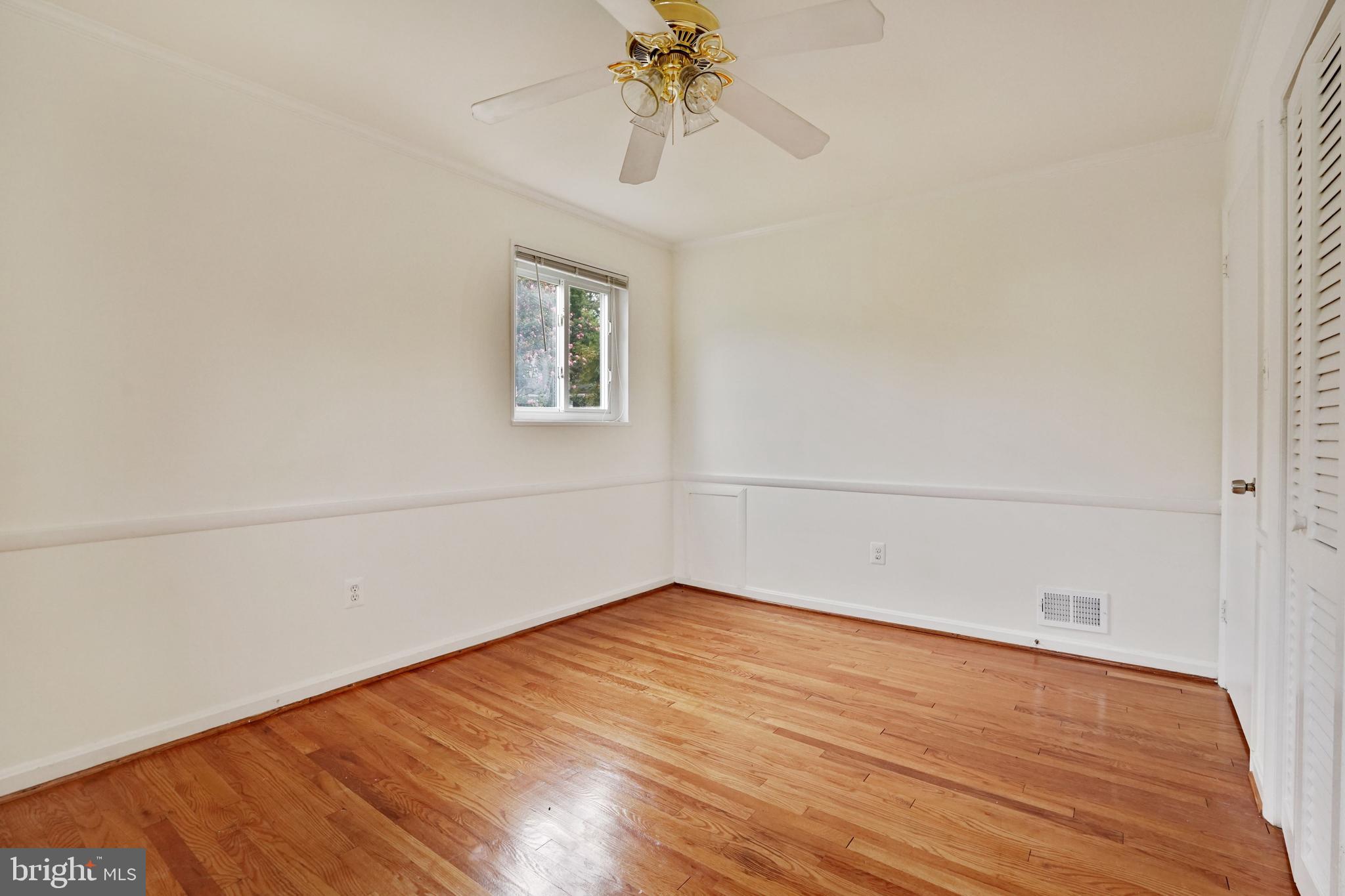 2911 Farm Road Alexandria, VA 22302 - Photo 23 of 35 a view of a room with wooden floor and chandelier