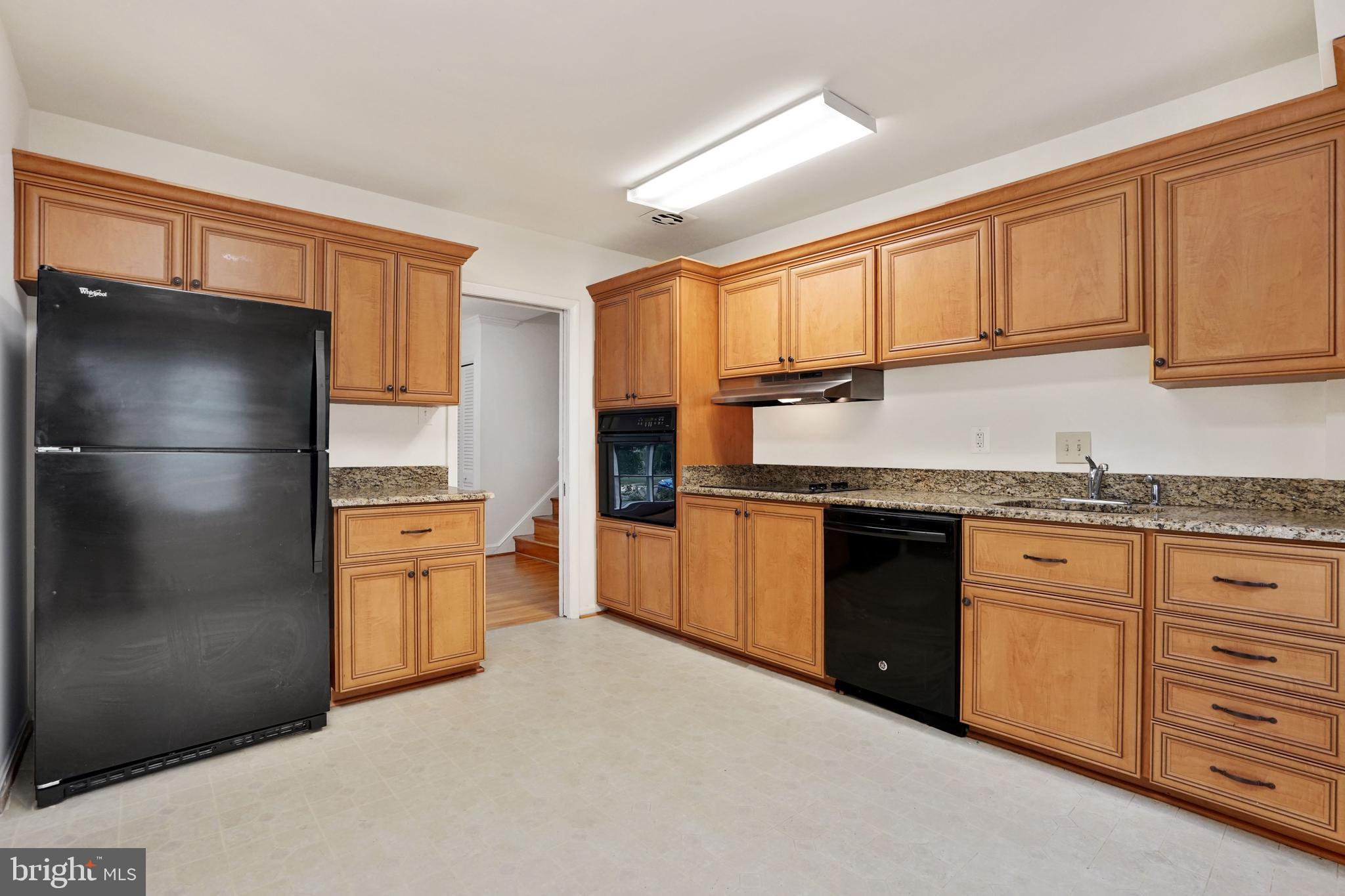 2911 Farm Road Alexandria, VA 22302 - Photo 7 of 35 a kitchen with stainless steel appliances granite countertop a refrigerator and a sink