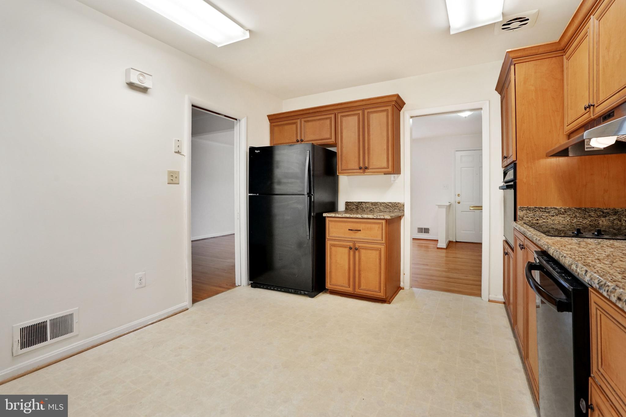 2911 Farm Road Alexandria, VA 22302 - Photo 8 of 35 a kitchen with a refrigerator and a sink