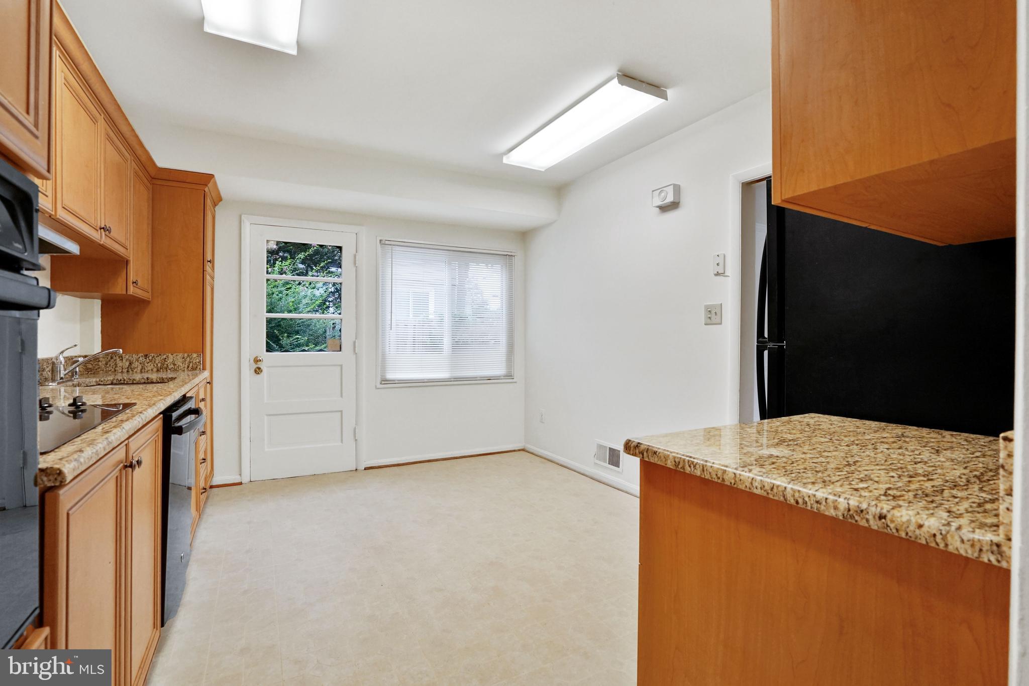 2911 Farm Road Alexandria, VA 22302 - Photo 9 of 35 a view of kitchen cabinets and wooden floor