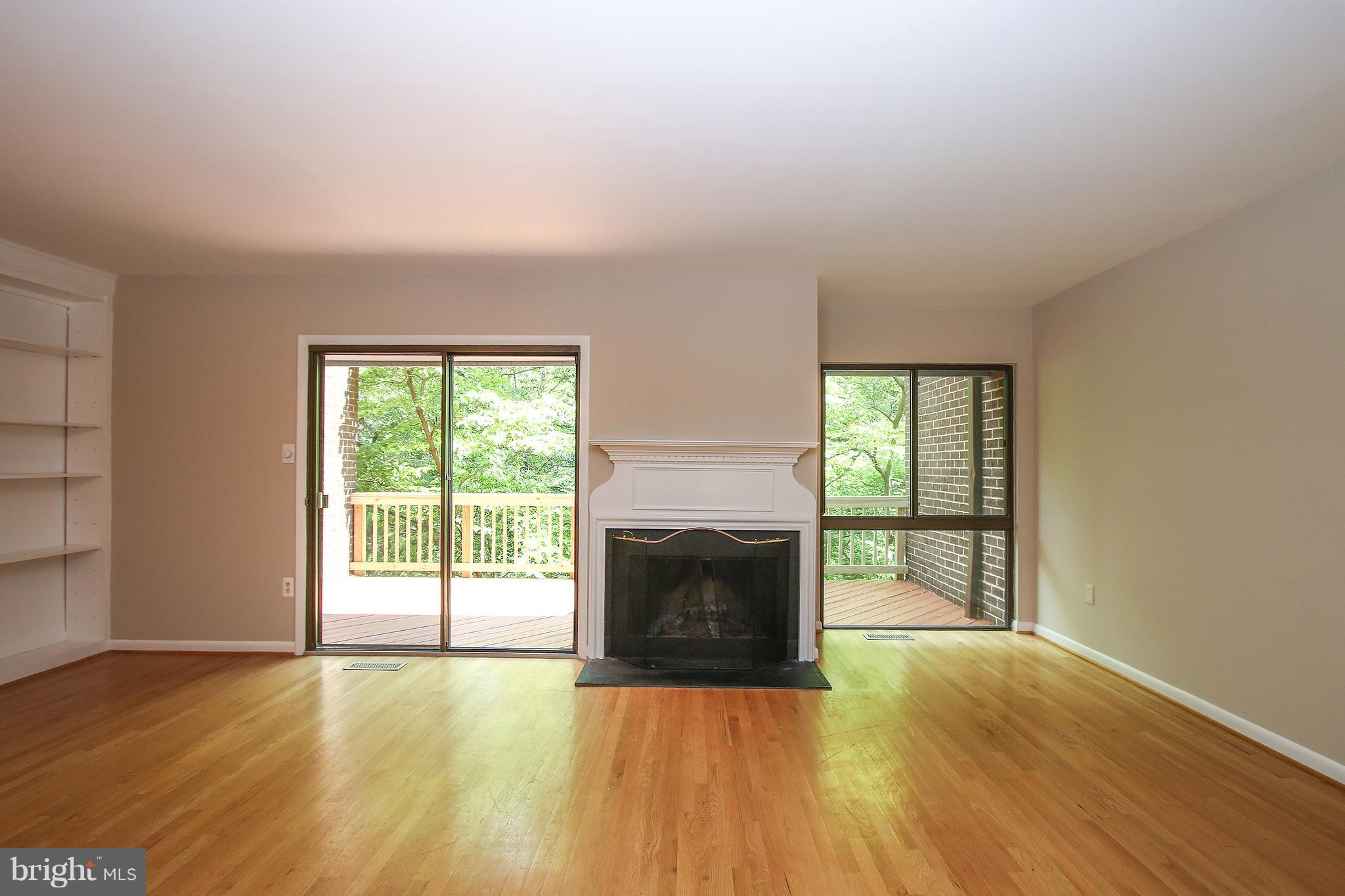 2033 Wethersfield Court Reston, VA 20191 - Photo 14 of 30 Living Room With Cozy Fireplace