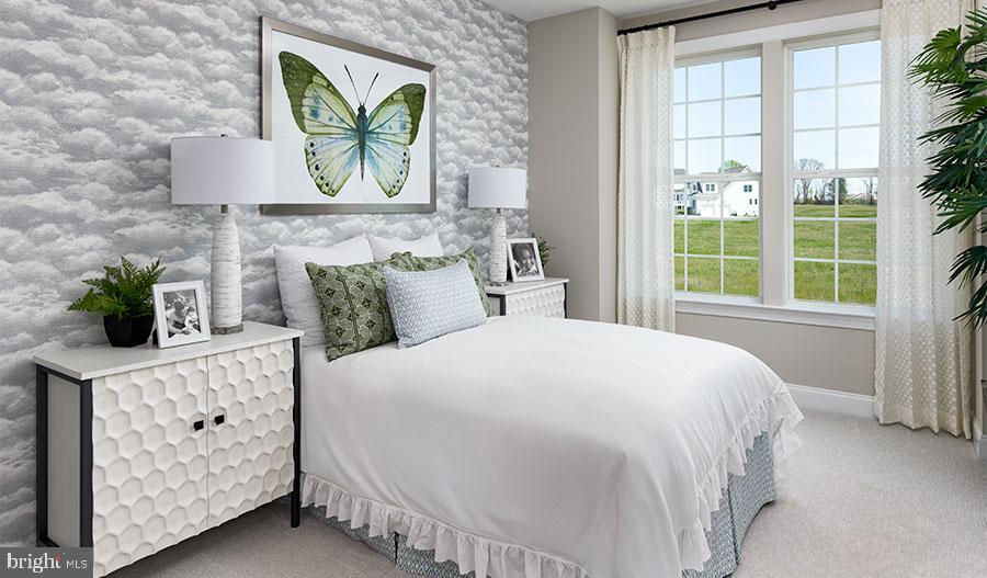 2007 St James Road Accokeek, MD 20607 - Photo 7 of 20 a bedroom with a bed a dresser and next to a window