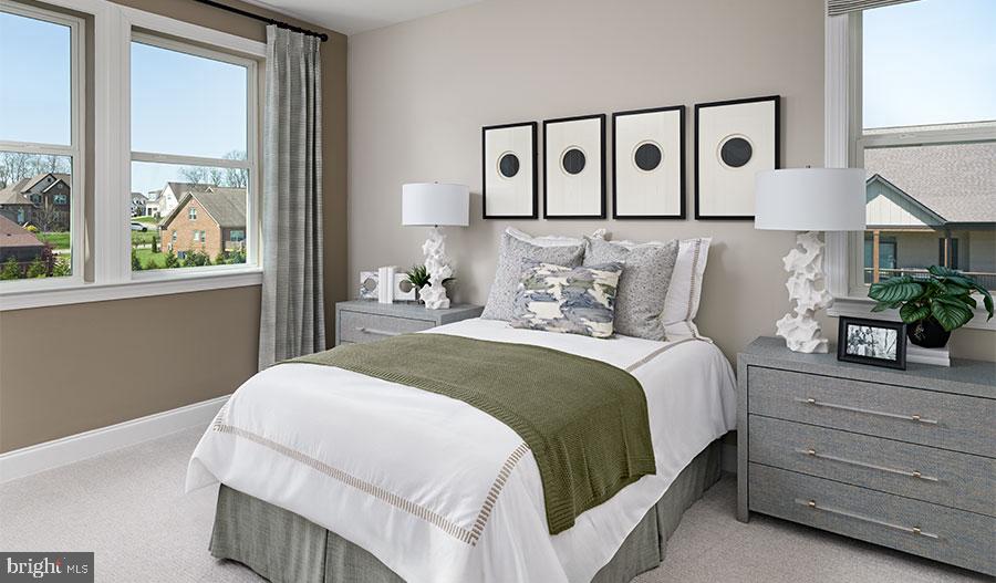 2007 St James Road Accokeek, MD 20607 - Photo 9 of 20 a bedroom with a large bed and a large window