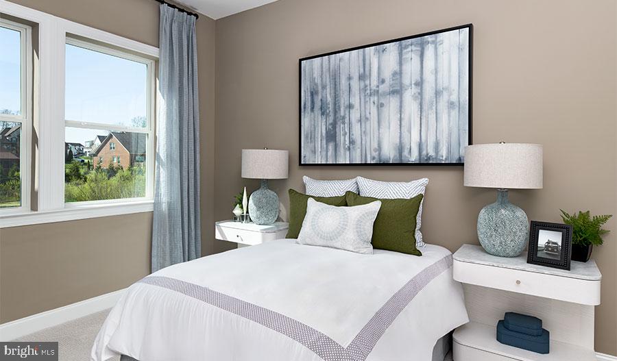 2007 St James Road Accokeek, MD 20607 - Photo 10 of 20 a bedroom with a bed and wooden floor