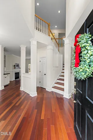 a view of entryway with stairs and wooden floor