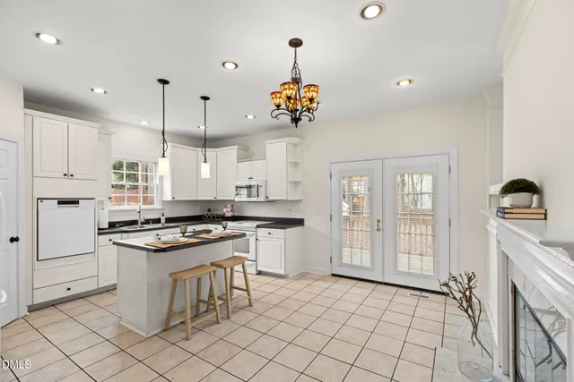 a kitchen with stainless steel appliances granite countertop a stove and a refrigerator