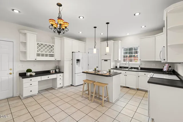 a kitchen with a sink cabinets and window