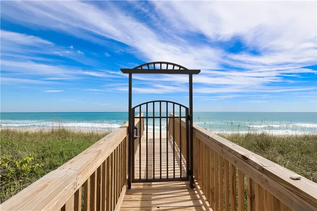 a view of a swimming pool with a patio