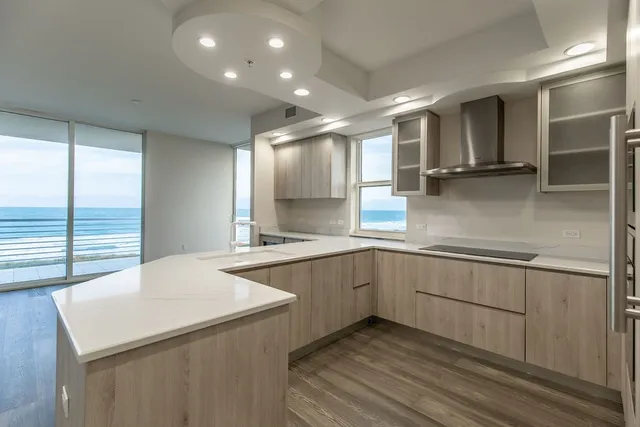 a kitchen with a sink cabinets and window