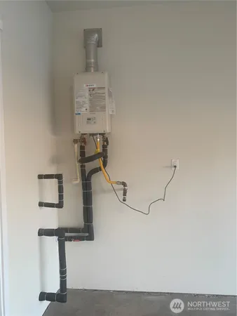 a room with gym equipment and wooden floor