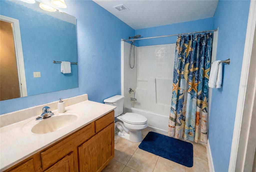217 Tres Reyes Lane Groveland, FL 34736 - Photo 15 of 20 a bathroom with a sink toilet and shower