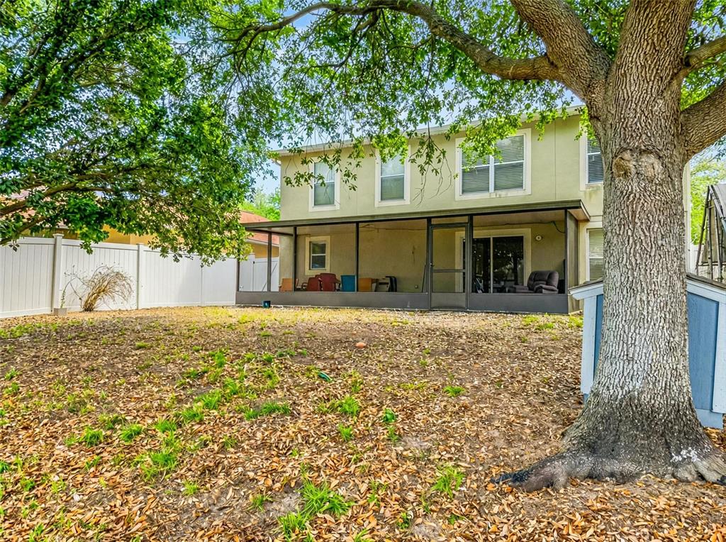 217 Tres Reyes Lane Groveland, FL 34736 - Photo 19 of 20 front view of a house with a small yard