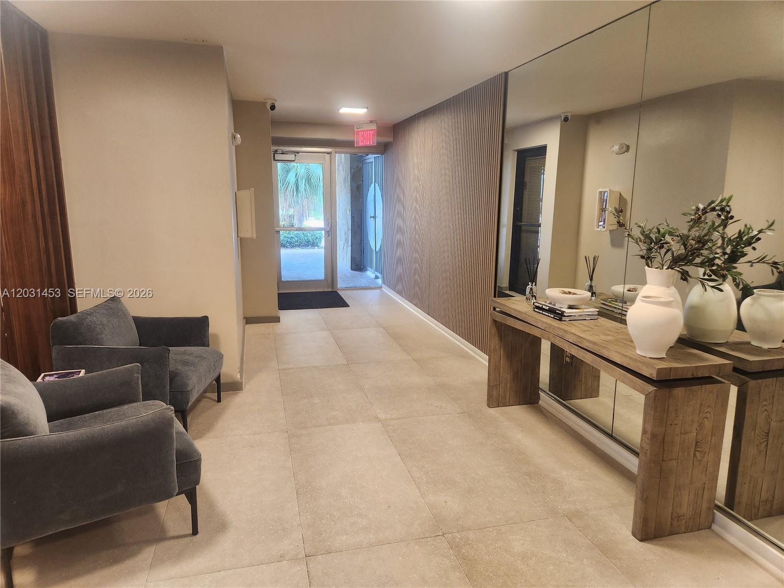 1605 Bay Road, Unit 503 Miami Beach, FL 33139 - Photo 21 of 23 a view of living room filled with furniture and window