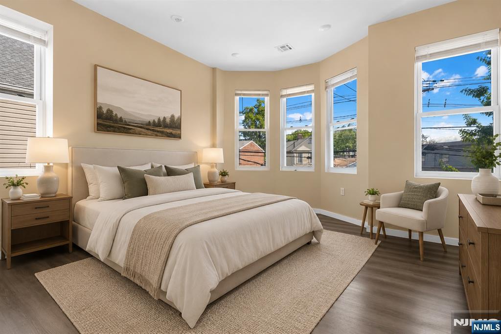 183 Bergen Turnpike Ridgefield Park, NJ 07660 - Photo 6 of 18 a bedroom with bed and a large window