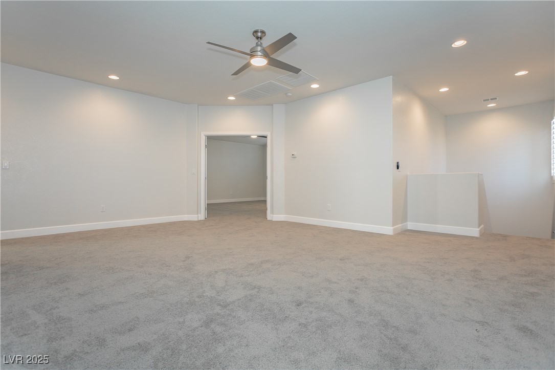 971 Huntington Cove Parkway Las Vegas, NV 89178 - Photo 28 of 55 Spare room featuring recessed lighting, ceiling fan, and light carpet