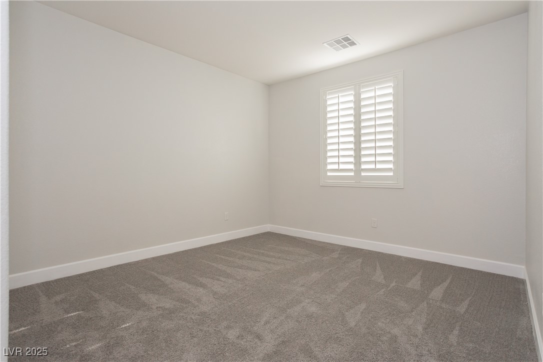 971 Huntington Cove Parkway Las Vegas, NV 89178 - Photo 33 of 55 Spare room with carpet and baseboards